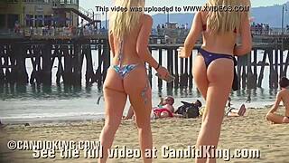 Nasty teen sisters in bikinis exposing huge behinds to the camera in the open área