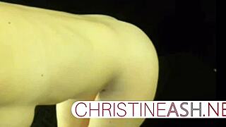 Hot MILF Christineash shows off her big boobs in fishnet and red heels