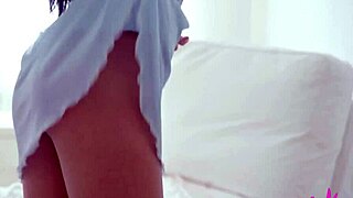 In this solo video is Ashanti's hairless pussy and big tits