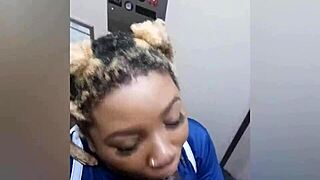 Watch young black slut deepthroat a large black cock in the bathroom