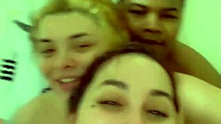 Mistress and her subjects take pleasure in an erotic shower scene in this video