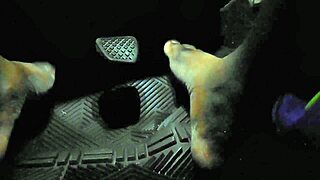 Driver touches gas pedal with bare toes