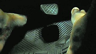 Driver touches gas pedal with bare toes