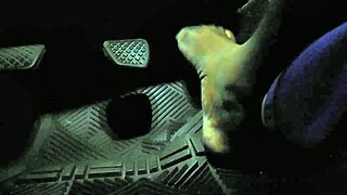 Driver touches gas pedal with bare toes