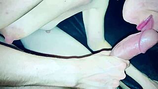 This petite MILF is blowing cock close-up.