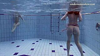 Two beautiful ladies wearing bikinis are shown enjoying their time in a showerขณะที่สวมชุดบิกินี,.getBeanTwo beautiful ladies wearing bikinis are shown enjoying their time in a shower