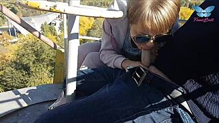 Shameless whore gives public blowjob on ferris wheel.