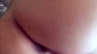 Is this hot tattooed blonde playing with her big tits?