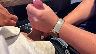 Milf delivers sloppy handjob in public park