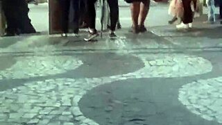 Hot brunette flaunts legs at bus stop