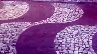 Hot brunette flaunts legs at bus stop