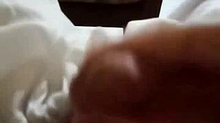 Two gay men engage in a full fuck session, exploring each other's cocks passionately.