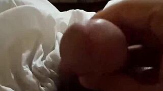 Two gay men engage in a full fuck session, exploring each other's cocks passionately.