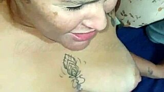 African Beauty with Big Tits and Tattooed Ass Teases Cock