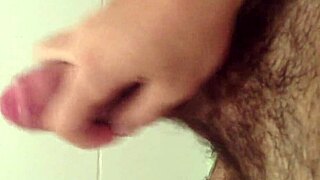 Friendly gay handjob session with a greasy cock