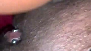 Ebony MILF rubs her clit hard in homemade video. She squirts intensely while masturbating for the camera.