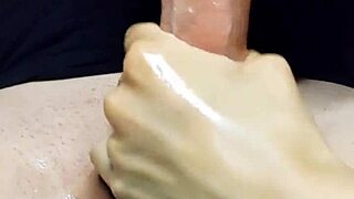 She gave an oiled handjob that made him cum hard.