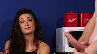 Clothed brunette observes the humiliation scene with femdom elements