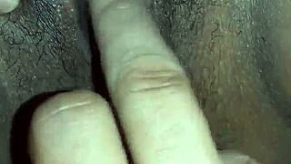 I finger my wife's clit passionately.