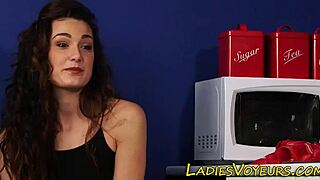 Clothed brunette observes the humiliation scene with femdom elements