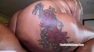 Darkskinned woman licking an extra large dick with a wide round black ass on a motorcycle