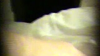 hidden cam catches cute blonde masturbating behind curtain
