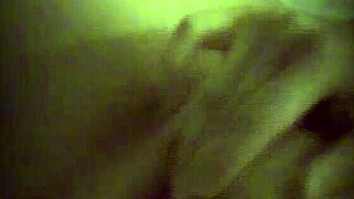 hidden cam catches cute blonde masturbating behind curtain