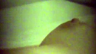 hidden cam catches cute blonde masturbating behind curtain