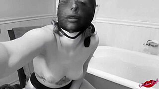 vintage babe has fun in the tub with toys and dildo