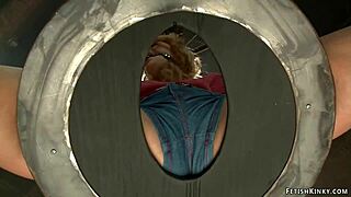 BDSM scene, blonde with gagged birds cage hard core