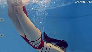big tits, ass and a horny brunette make themselves busy in the pool