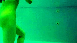 big tits, ass and a horny brunette make themselves busy in the pool