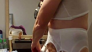 Black lingerie crossdresser poses for camera