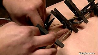 slave bound and gagged in bizarre bondage device