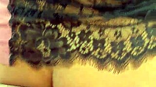 Hot curly blonde dances funk in pajamas in the kitchen.