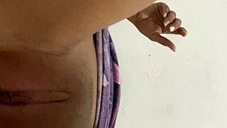 A young woman touches her smooth and young virgin like cunt as a solo act