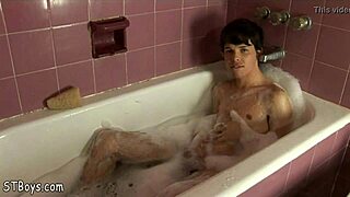 Nude Gay Twink Boy Having Fun Stroking His Cock In A Bubble Bath.