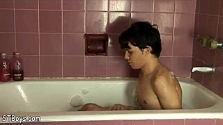 Nude Gay Twink Boy Having Fun Stroking His Cock In A Bubble Bath.