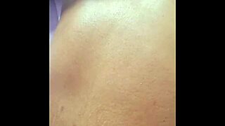 A Black woman naked and masturbating in front of the webcam