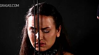 Domina unleashes harsh whipping on her bound redhead slave in intense session