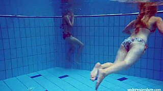 Marusia and Melisa have lesbian underwater pornographic sex in bikinis