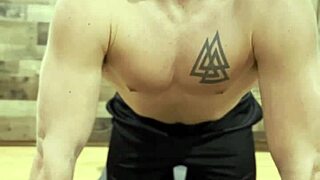 Stretching with Muscular Bodybuilder in Sexy Pose