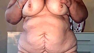 A mature and attractive woman with a face mask is shown fully naked