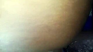 Housewife pulls pants aside on bed