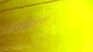 Housewife pulls pants aside on bed