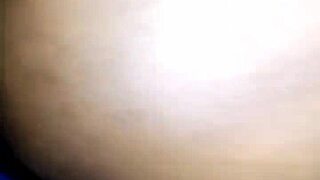 Housewife pulls pants aside on bed