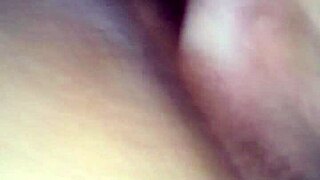 American woman playing with dildo toys