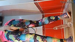 Intense close up dildo masturbation in gym shower with pee