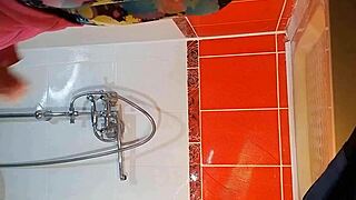 Intense close up dildo masturbation in gym shower with pee