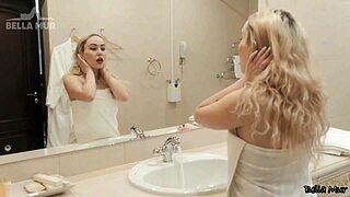 A slim and smooth skinned woman has sex with an artificial penis in the shower